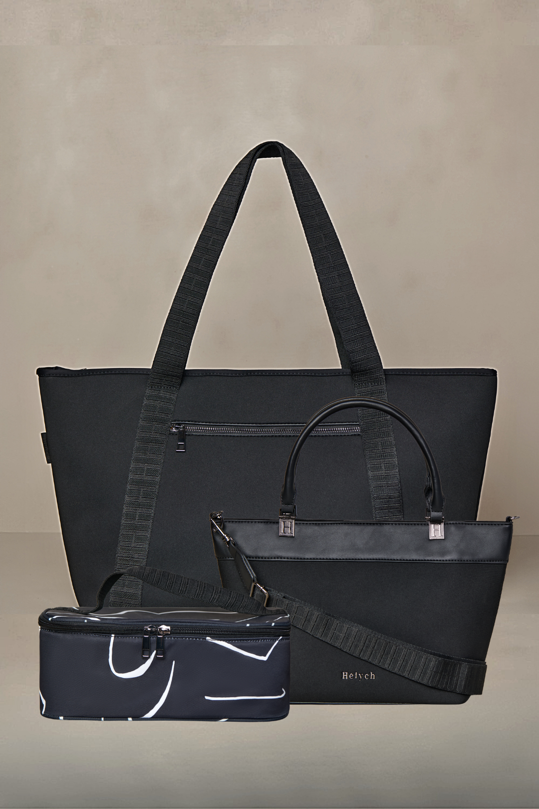 Black handbag with a smaller pouch on a beige background