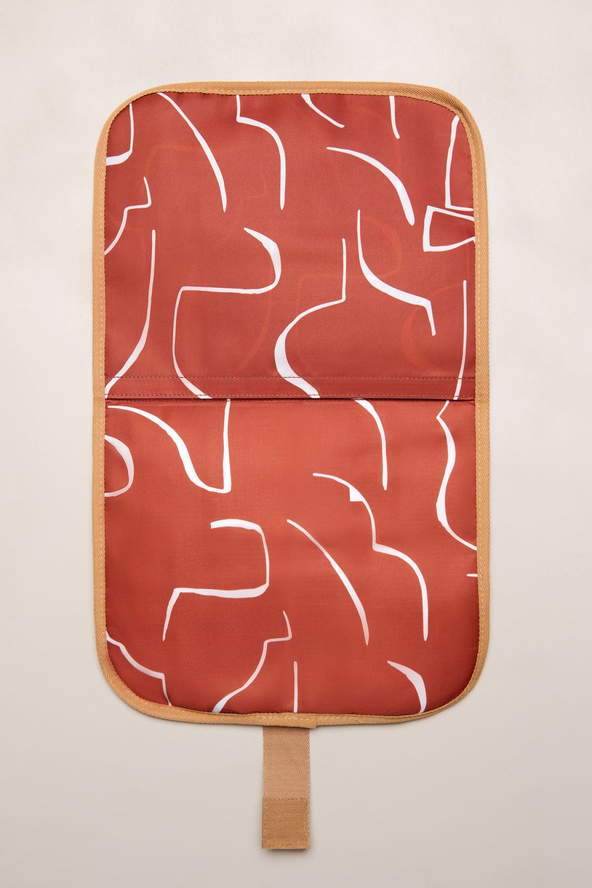 Tan Heiych change mat and laptop sleeve