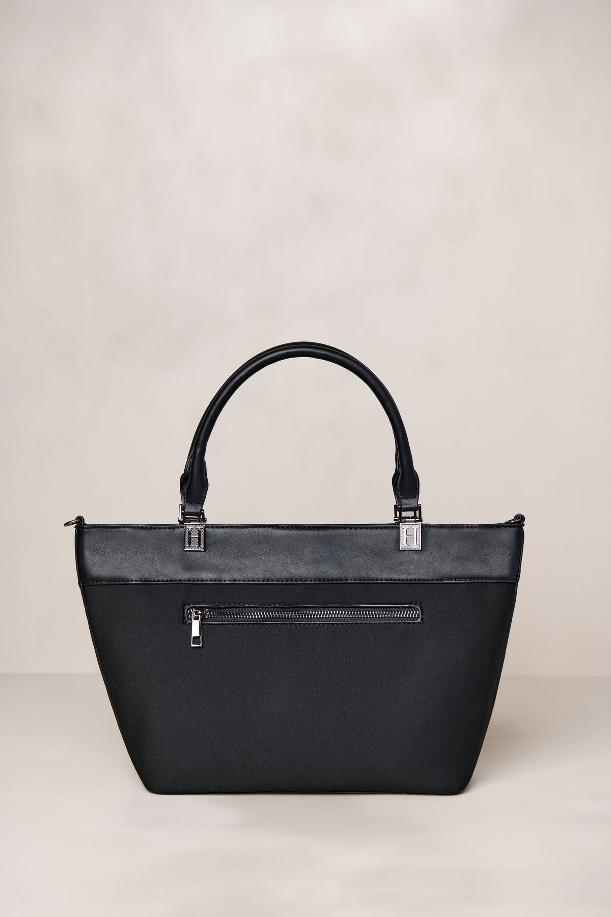 Black neoprene crossbody tote bag with handle and adjustable strap