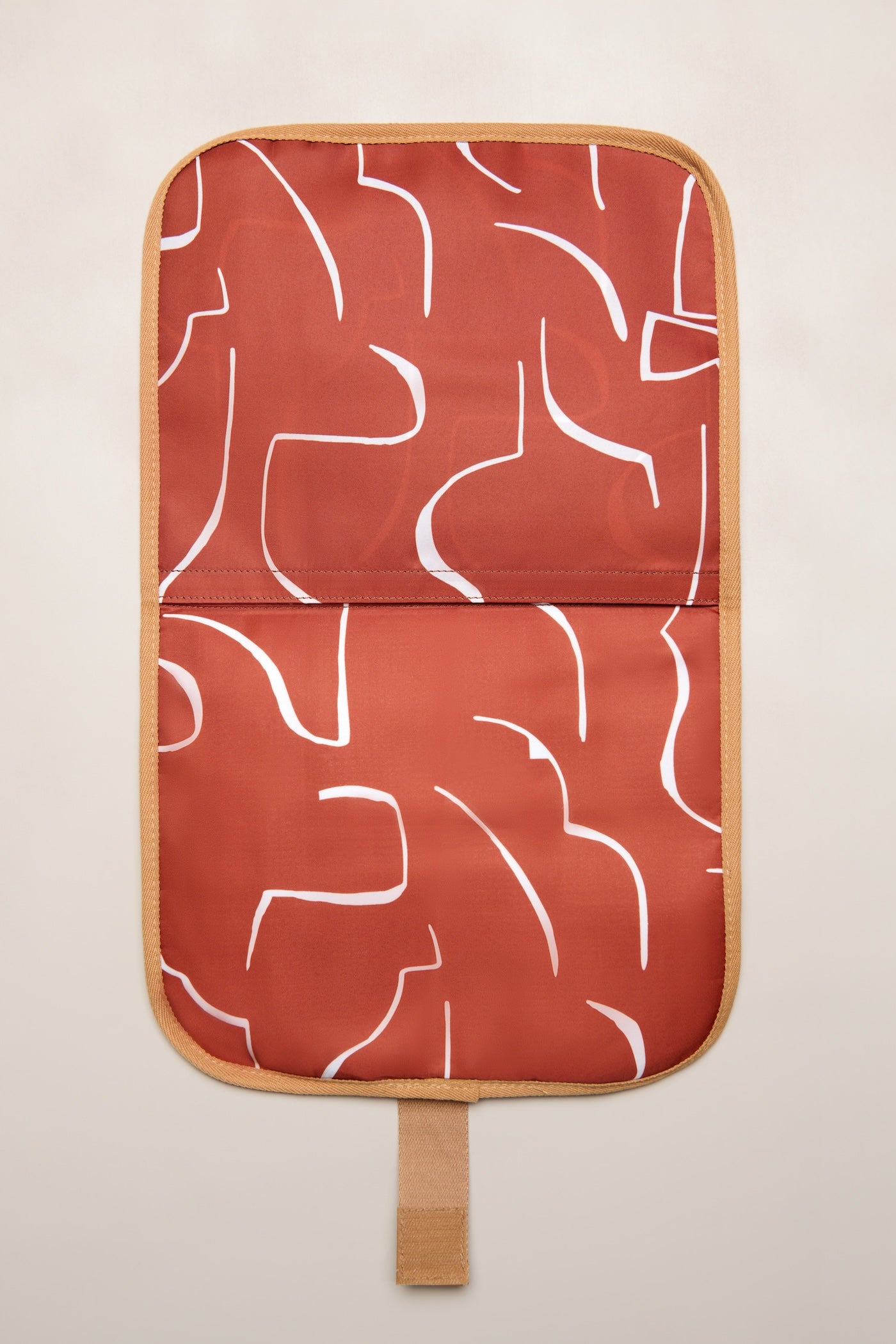 Tan Heiych change mat and laptop sleeve