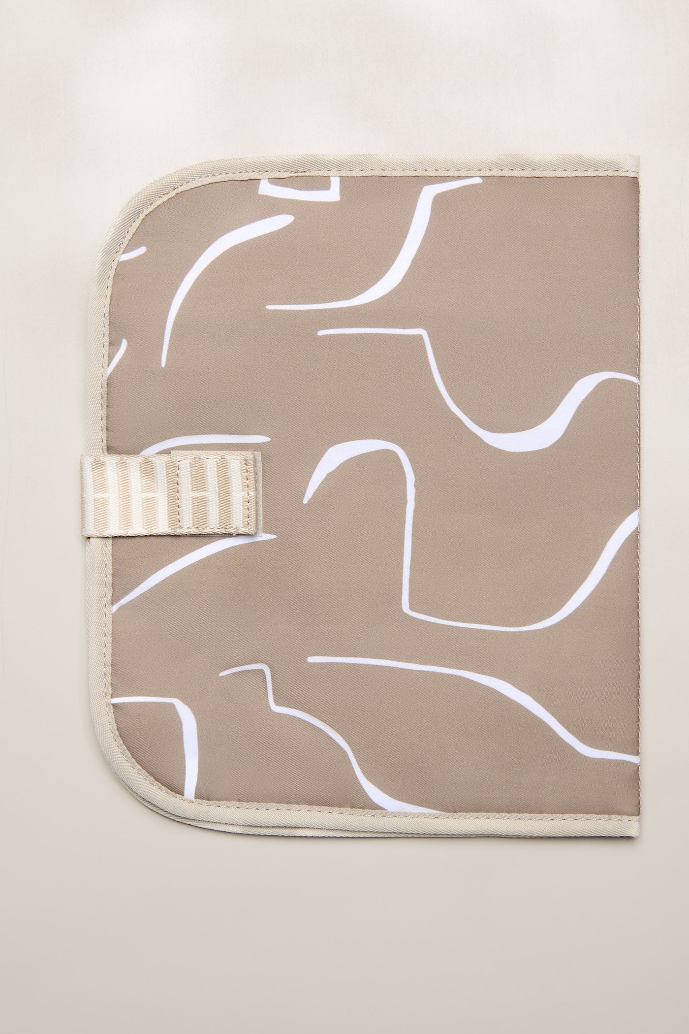 Taupe Heiych change mat and laptop sleeve