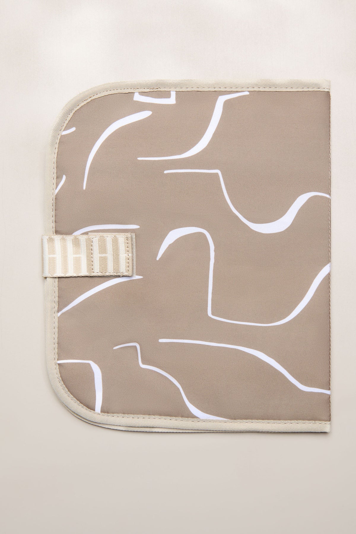 Taupe Heiych change mat and laptop sleeve