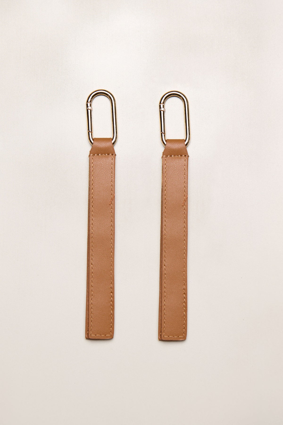 Tan Heiych H-Pram Straps for attaching bags to a pram