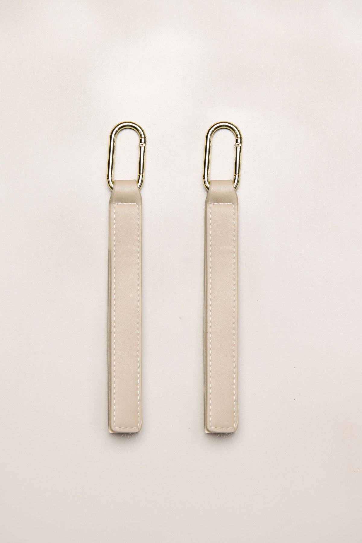 Taupe Heiych H-Pram Straps for attaching bags to a pram